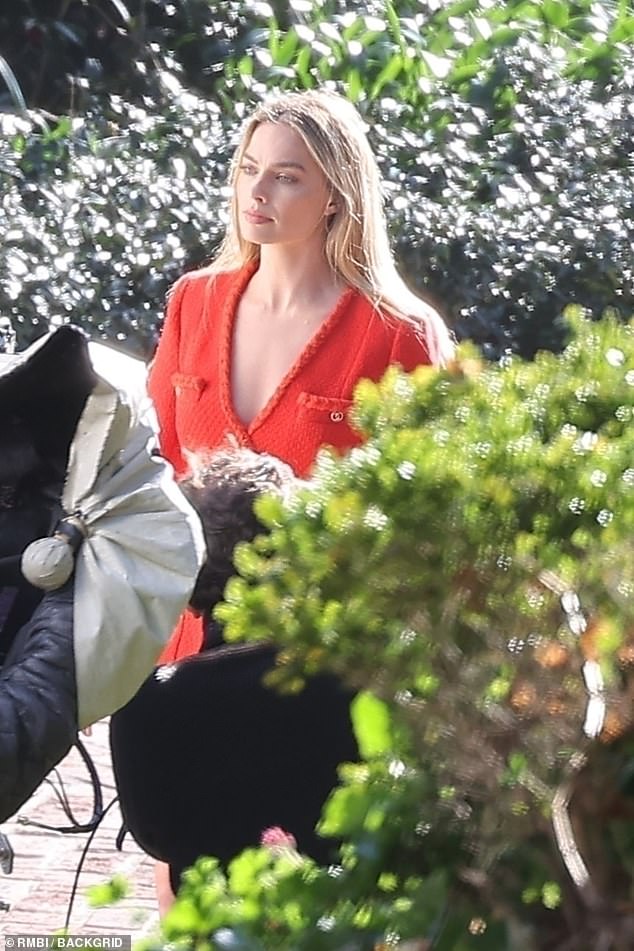 The Barbie star, 33, who was snubbed in the Best Actress category at the Oscars, looked stunning in a red Chanel suit